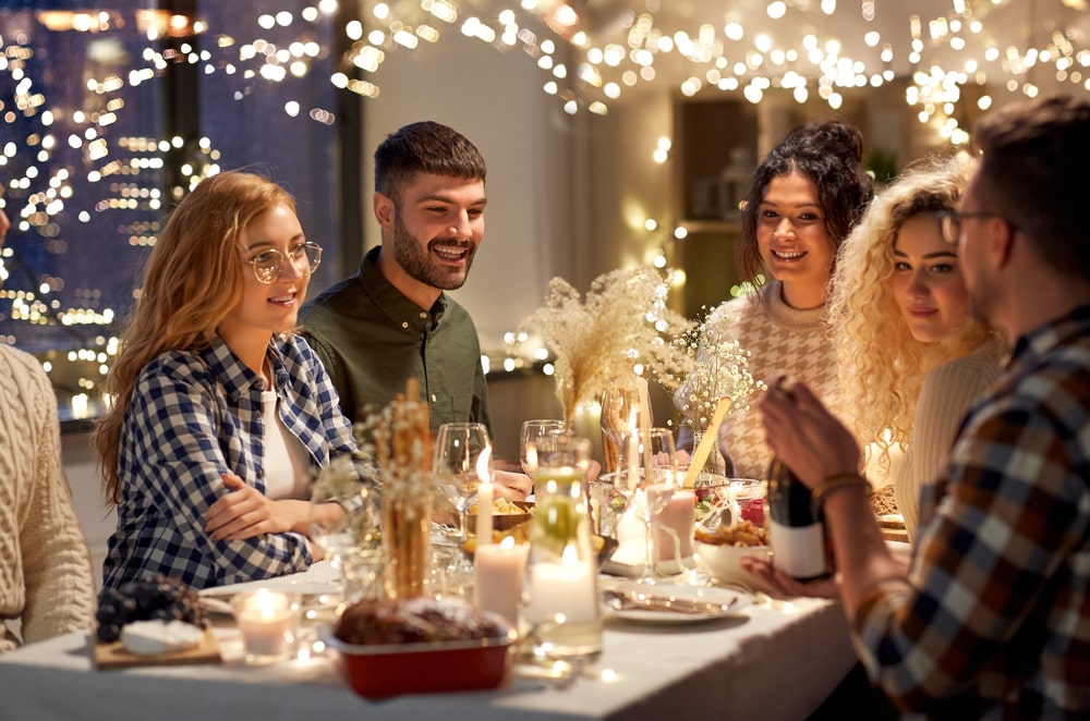 Family gathering around decorated table