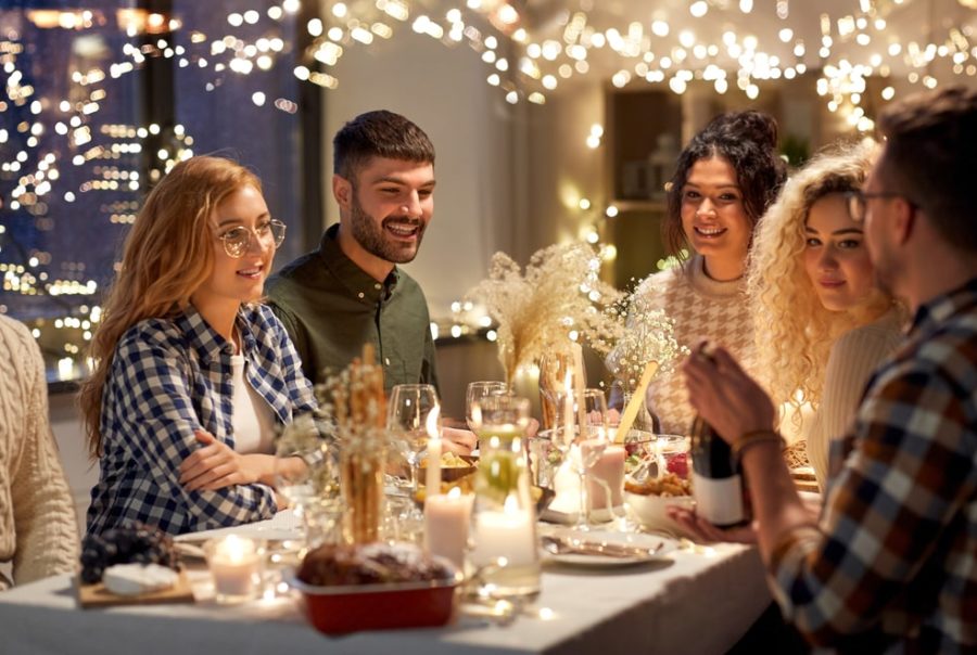 Family gathering around decorated table