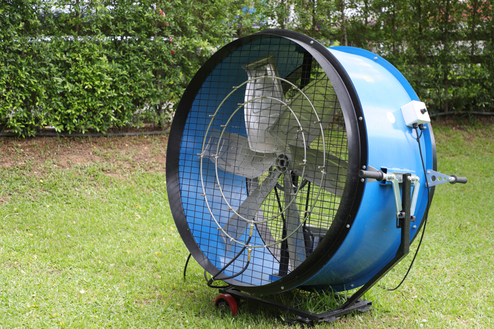 Large drum fan placed on a lawn