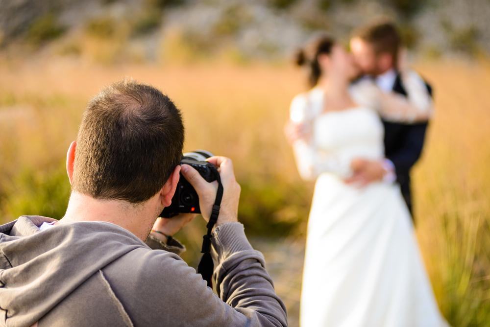 Wedding photographer shooting outside