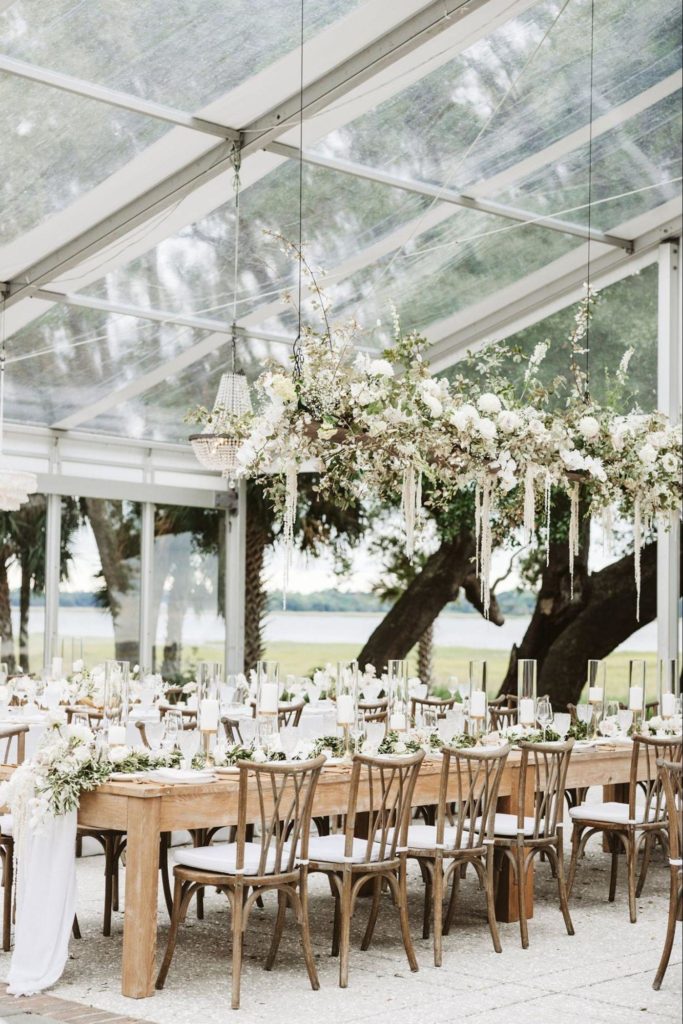 Wedding table rentals outside under a tent