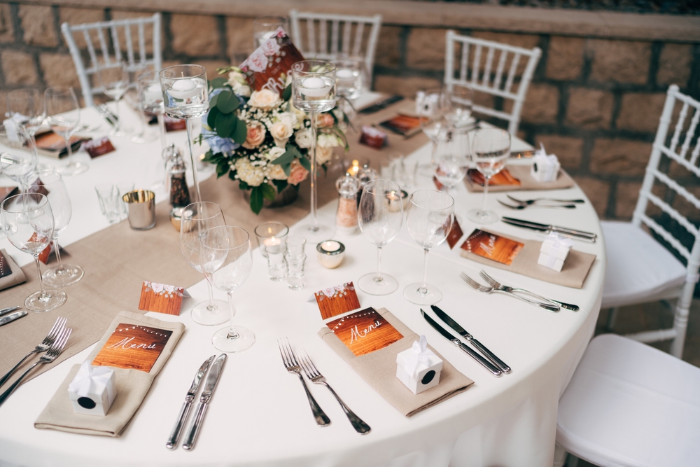 Wedding table with white linen and brown runner