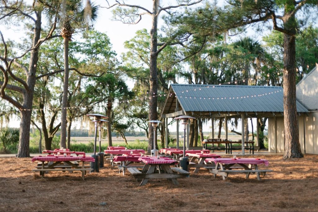 Outdoor corporate event with picnic tables