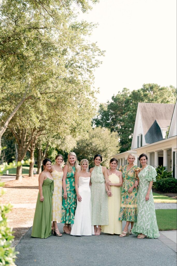 Bride with her bridesmaids maid of honor at her side.