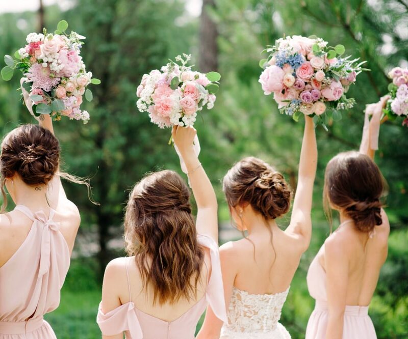 Bridesmaids holding beautiful bouquets