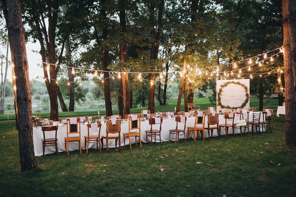 Banquet table outdoors amongst trees