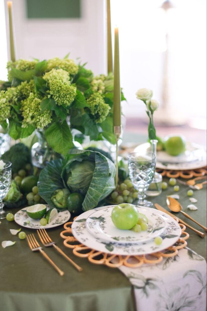 Beautiful green tablescape with vegetables and fruit as decor