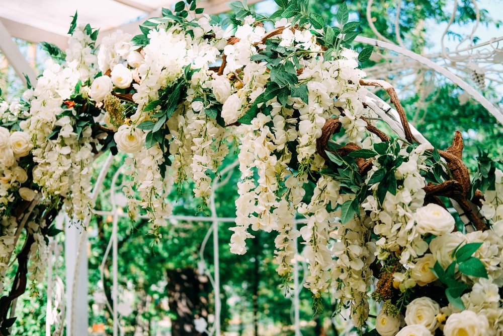 Wedding arch decorated with white flowers