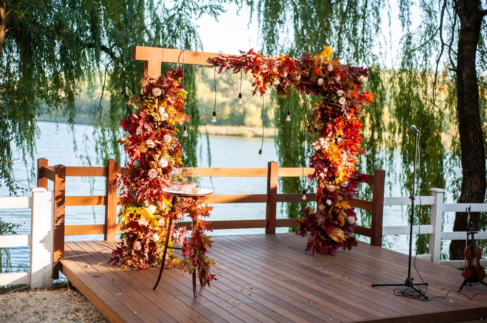 Wedding arch. Autumn wedding. Colorful leaves