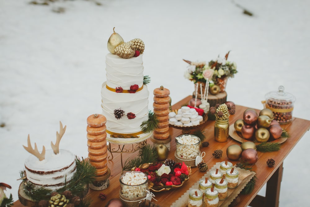 Wedding winter candy table and cake in the snow