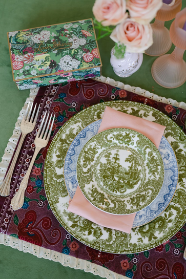 Dinner plates setup with pink napkins