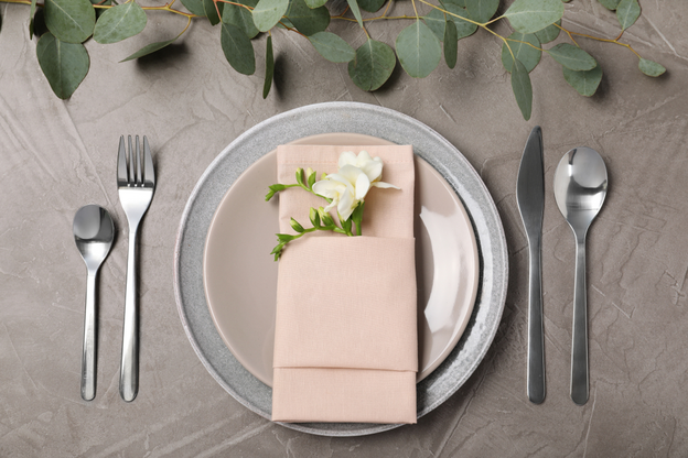 Festive table setting with plates, cutlery, and napkin