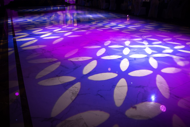 Light pattern on a dark dance floor created by professional lighting equipment