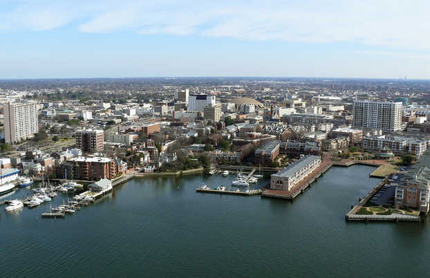 Aerial of Norfork Virginia's Chesapeak Bay shoreline, buildings and marinas