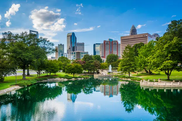 The skyline of Uptown Charlotte, and lake at Marshall Park, in Uptown Charlotte, North Carolina