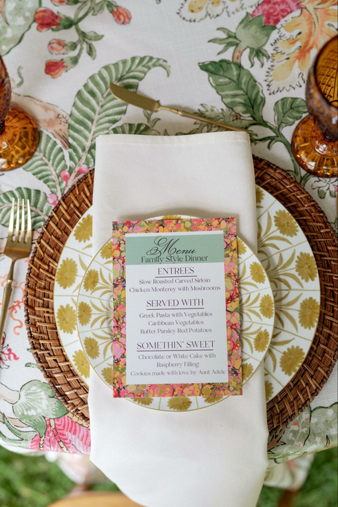 Wedding menu placed on top of plant themed table setting