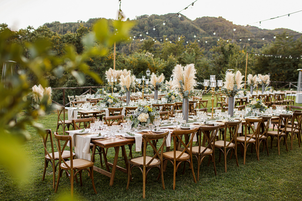 Wedding table set up in boho style with pampas grass and greenery