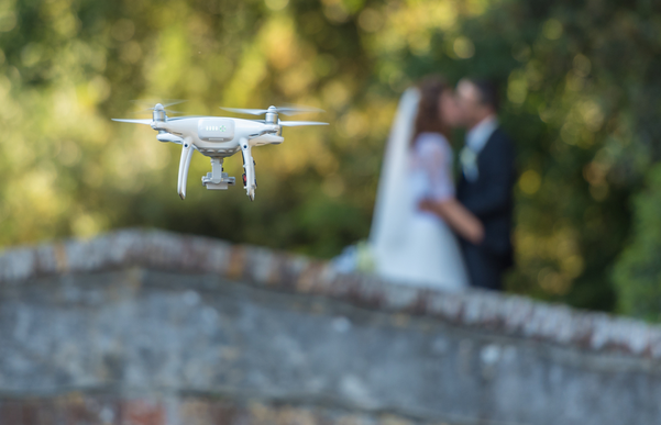 Drone taking footage of the bride and groom
