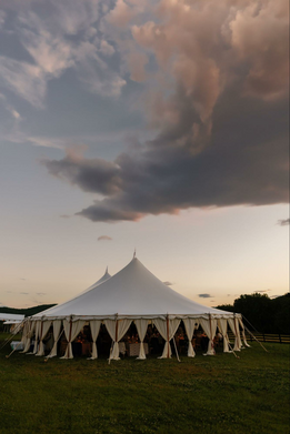 Wedding venue including decor as clouds hover right above it