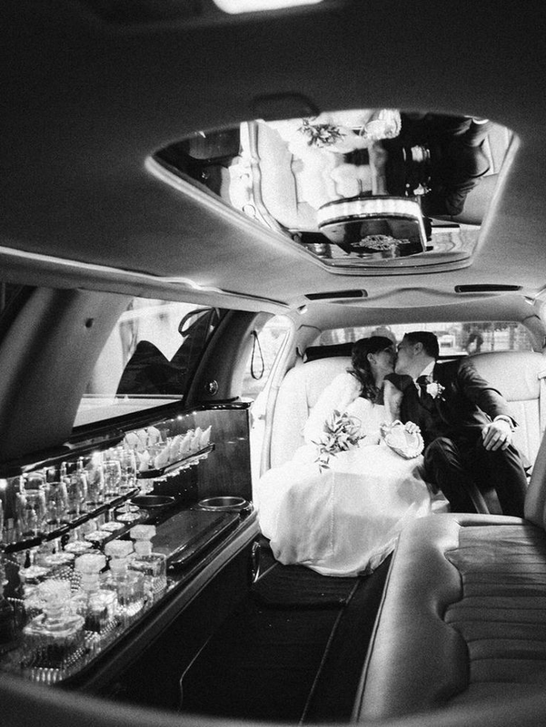 Couple seated in a Limousine 