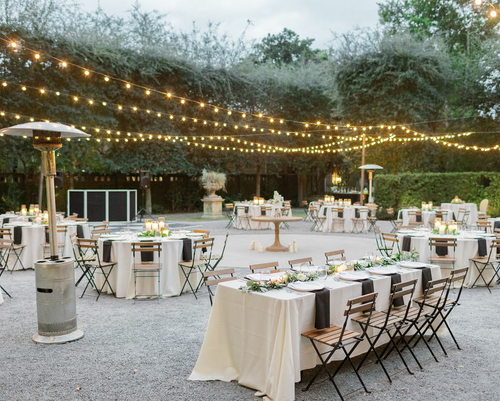 Wedding decor with lights, tables and chairs