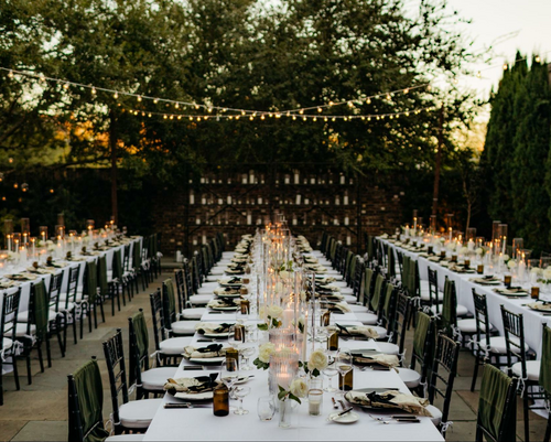 Wedding decor with lights, tables and chairs