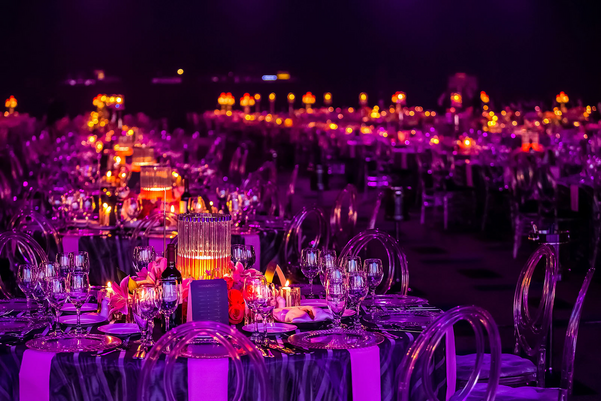 A gala dinner preparation, tables decorated with candles