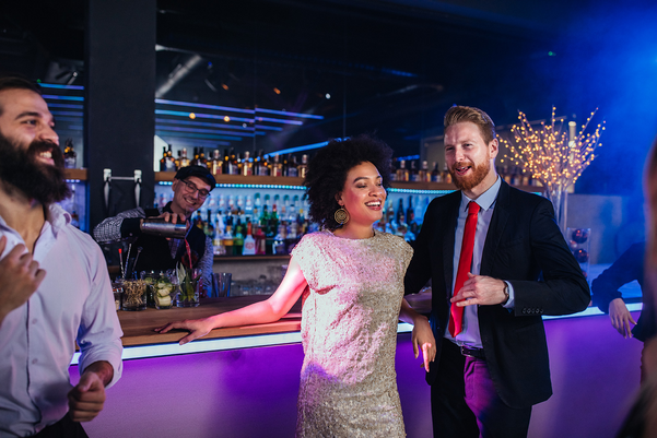 Couple standing at a wedding bar