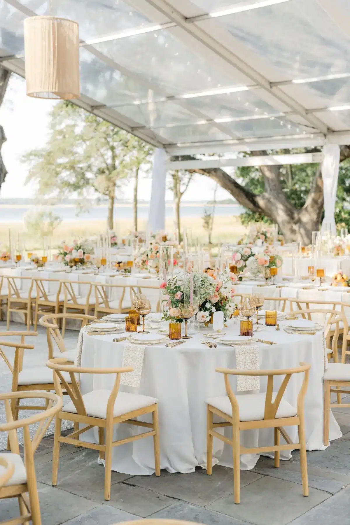 Clear-top tent wedding lighting at Charleston waterfront venue