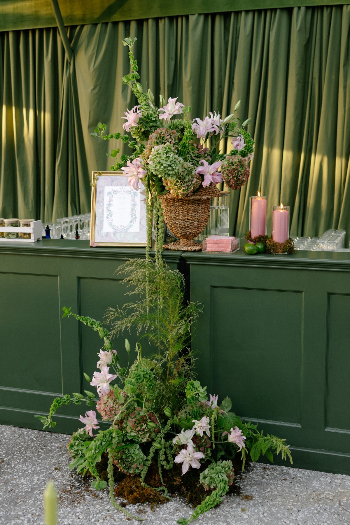 Green event bar with florals and candle decor