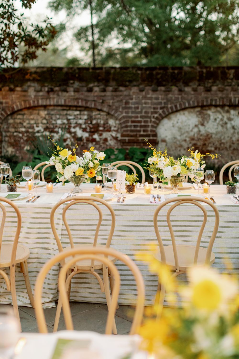Striped linen table with florals and candles