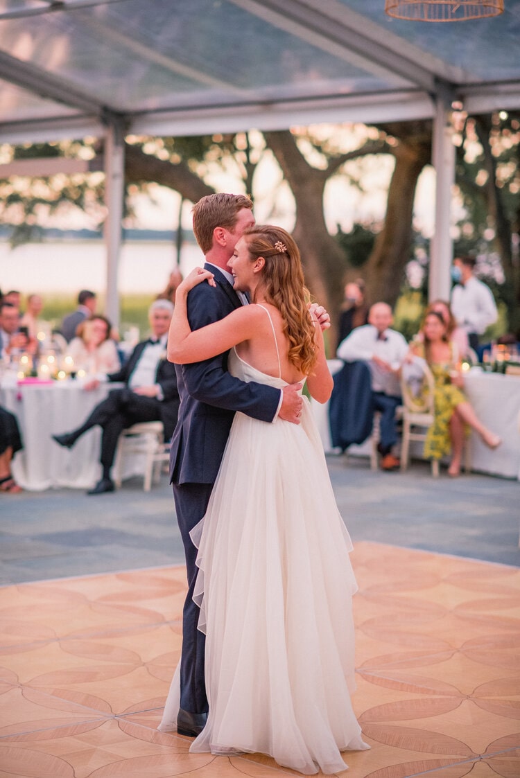 Couple dancing on a patterned wooden dance floor