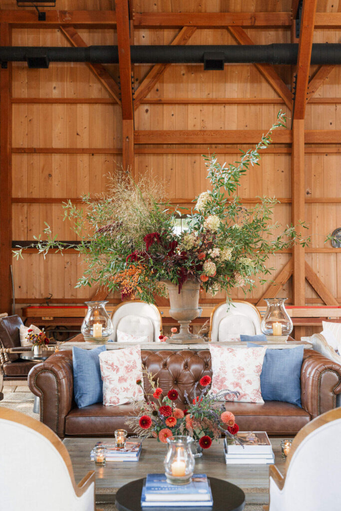 barn wedding lounge seating floral centerpiece