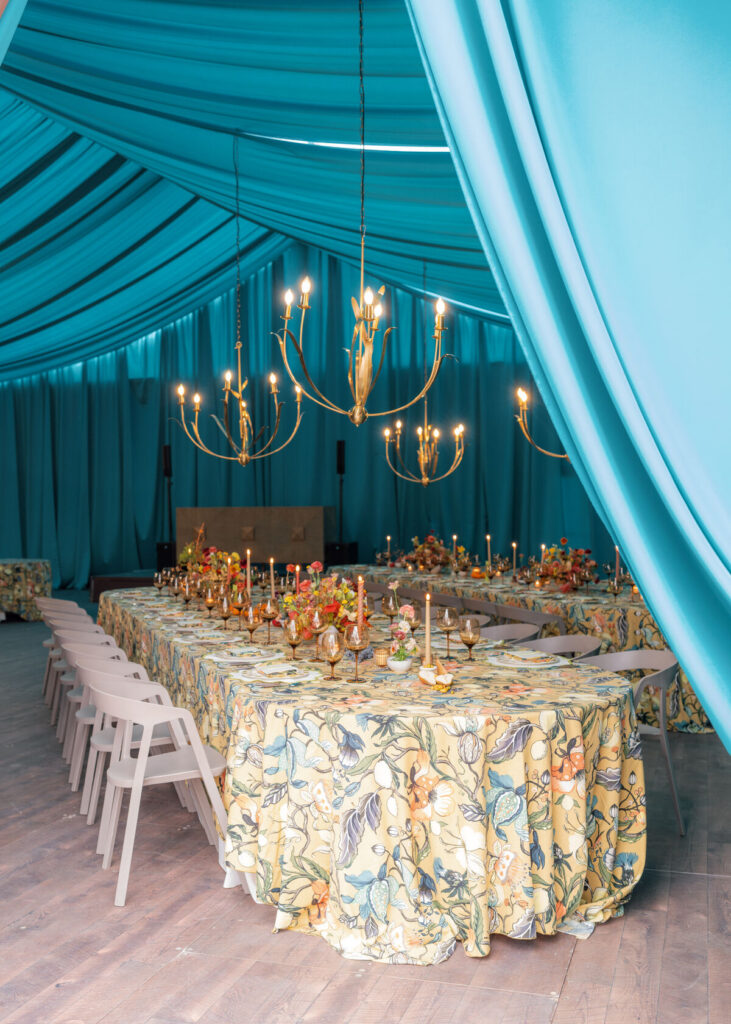 colorful wedding tent reception teal draping patterned tables