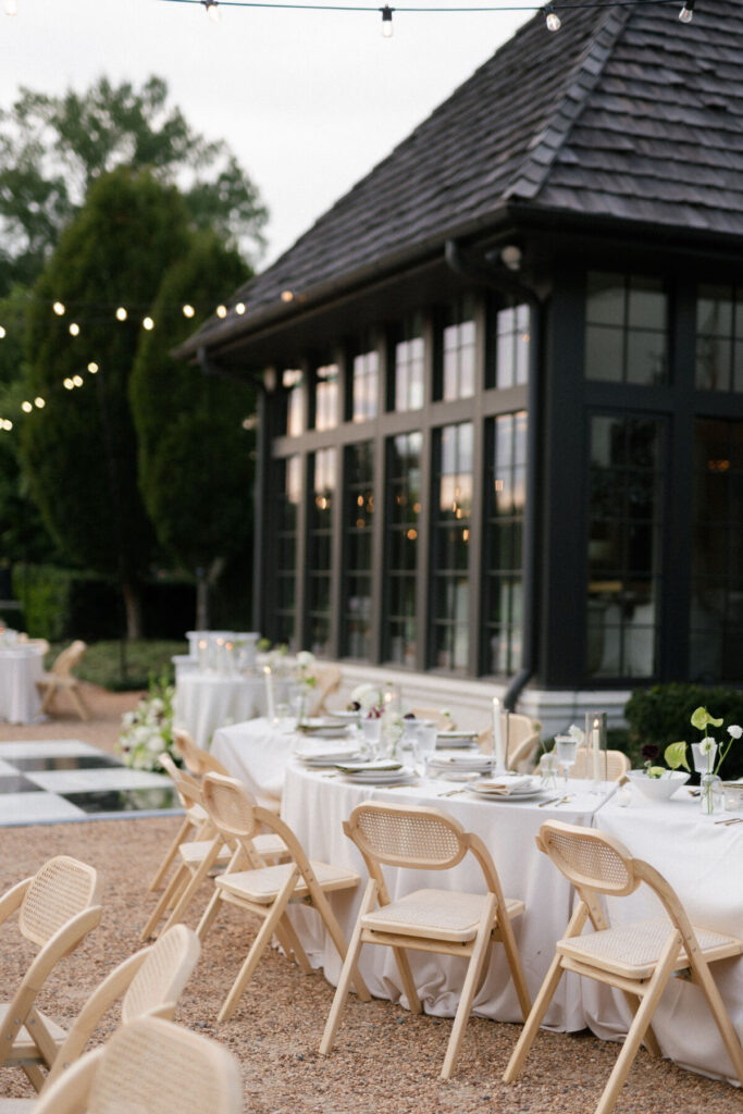 elegant garden wedding setup with pavilion and string lighting