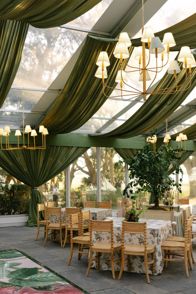 luxury wedding tent interior green drapery chandelier lighting