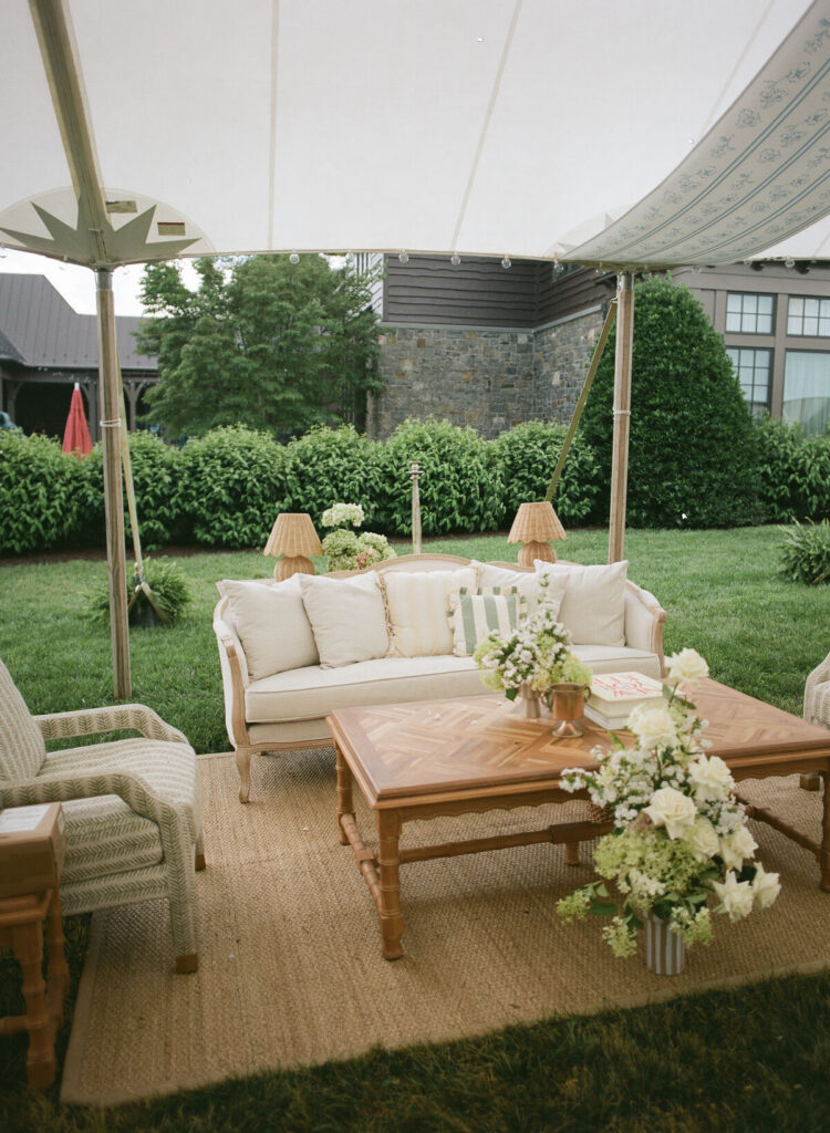 outdoor wedding lounge seating area under tent