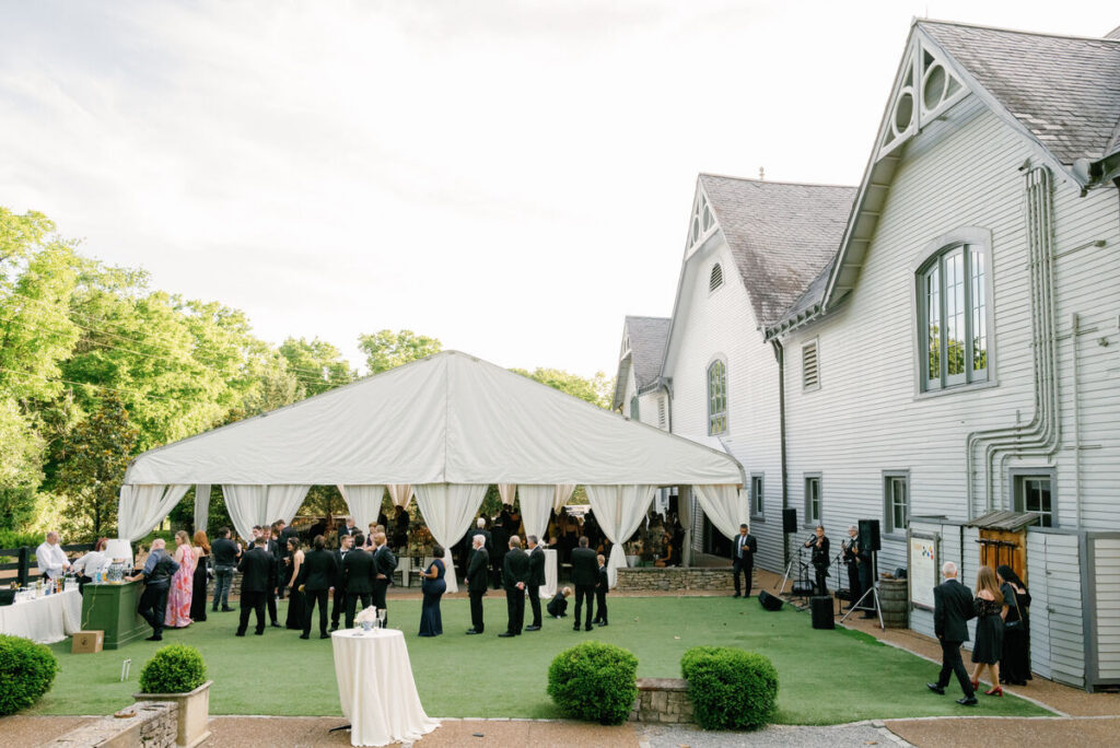 outdoor wedding tent cocktail hour venue guests