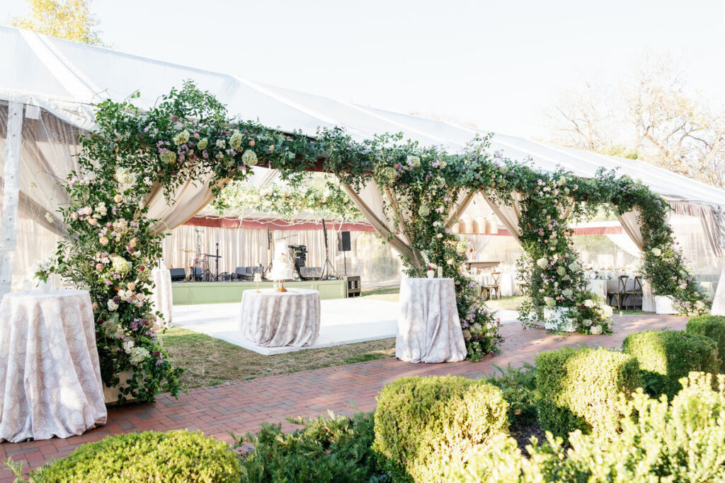wedding tent floral installation greenery arch structure
