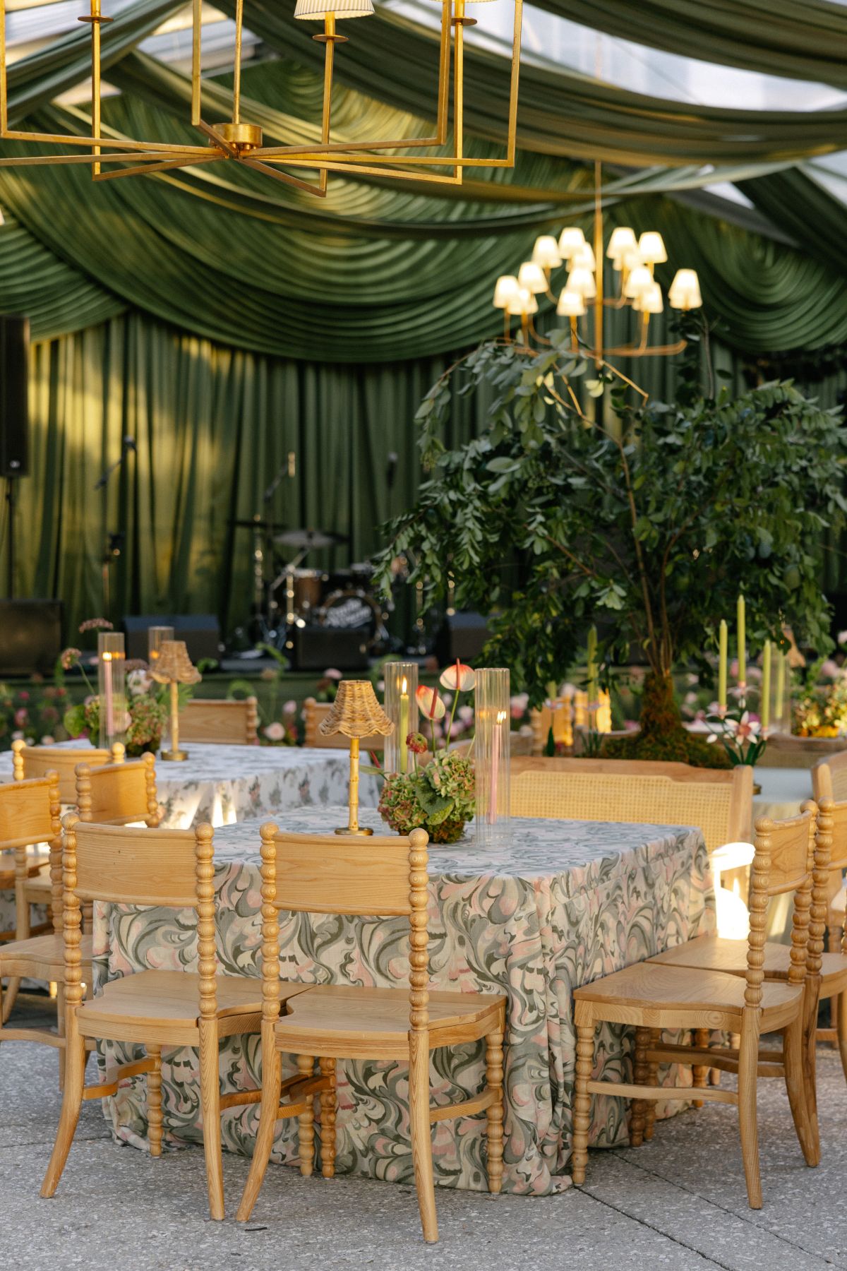 Chesapeake summer reception with round tables, rental chairs, and dramatic ceiling draping