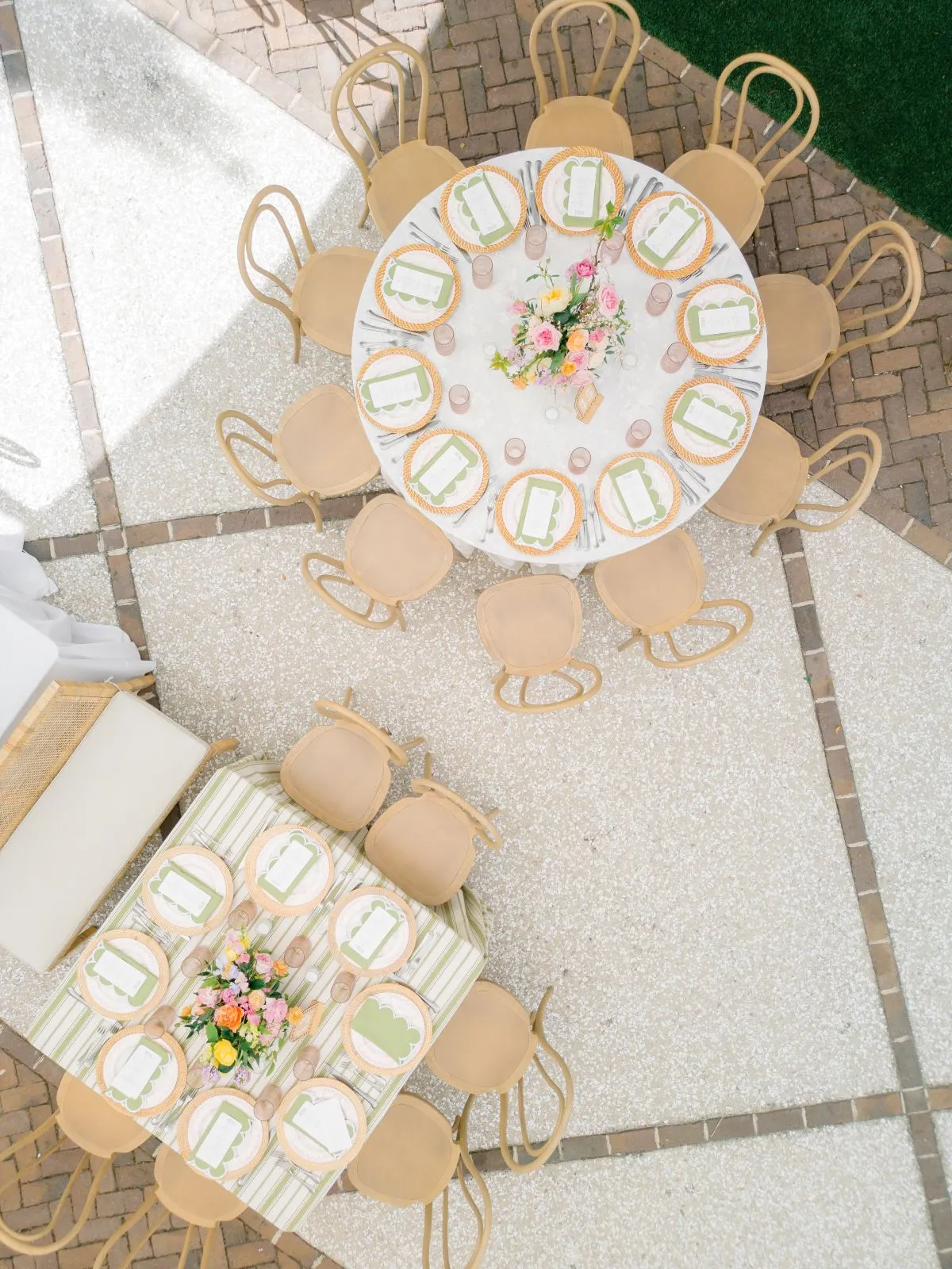Overhead view of formal event tables with linens and floral centerpieces