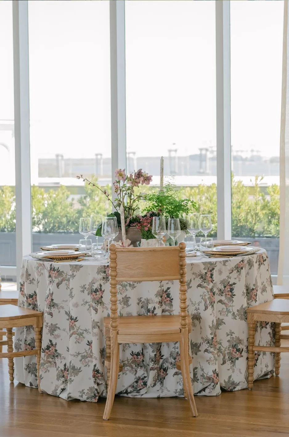 Formal dining table with floral linen, tabletop rentals, and wooden chairs